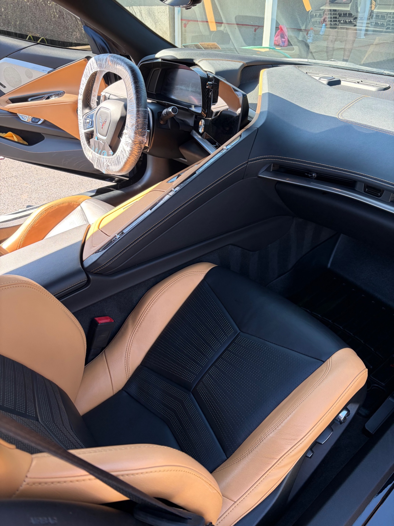 Chevrolet Corvette Stingray two-tone tan and black leather seats after interior detail