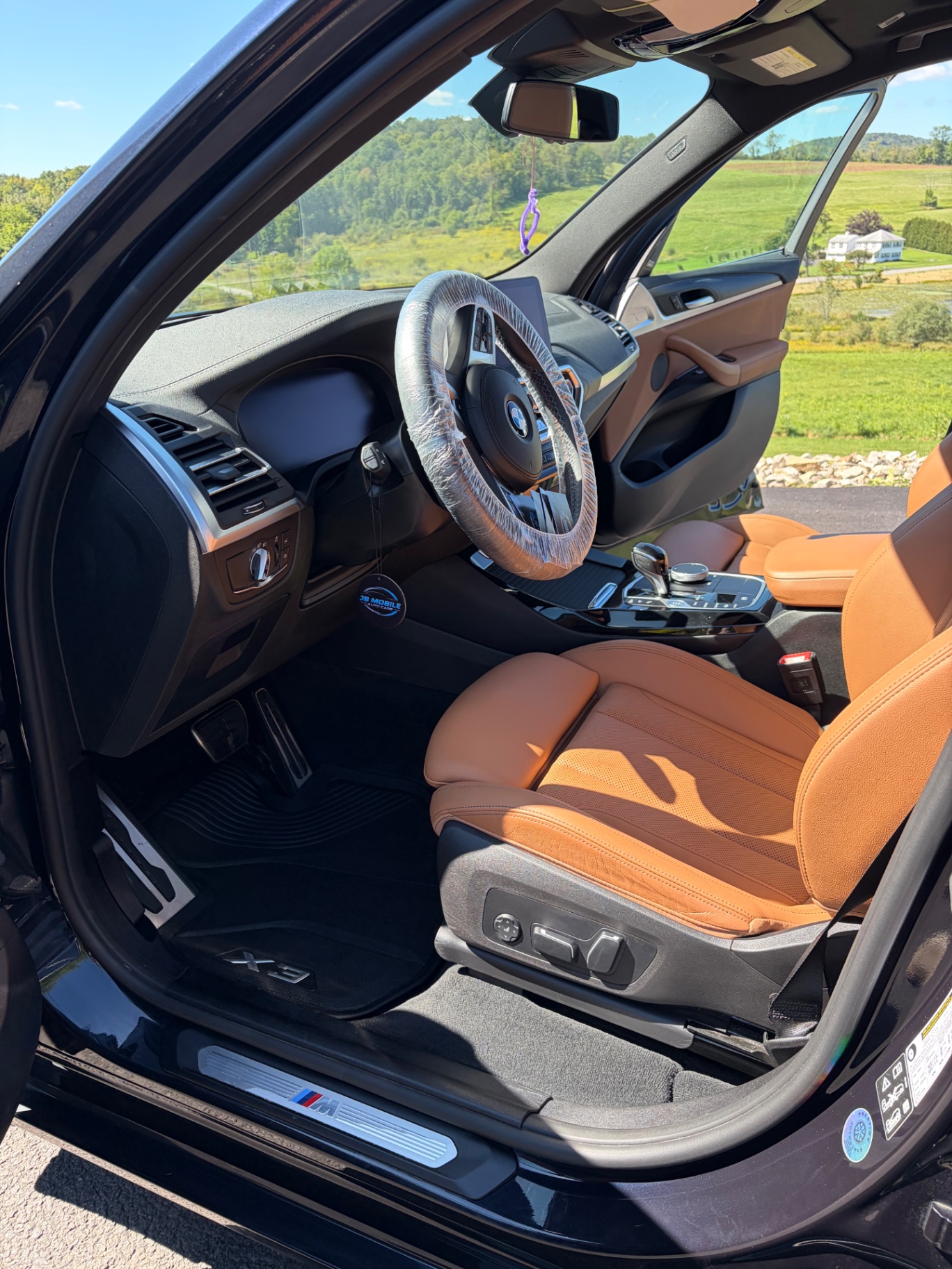 BMW X3 driver side with cognac leather seats after interior detail