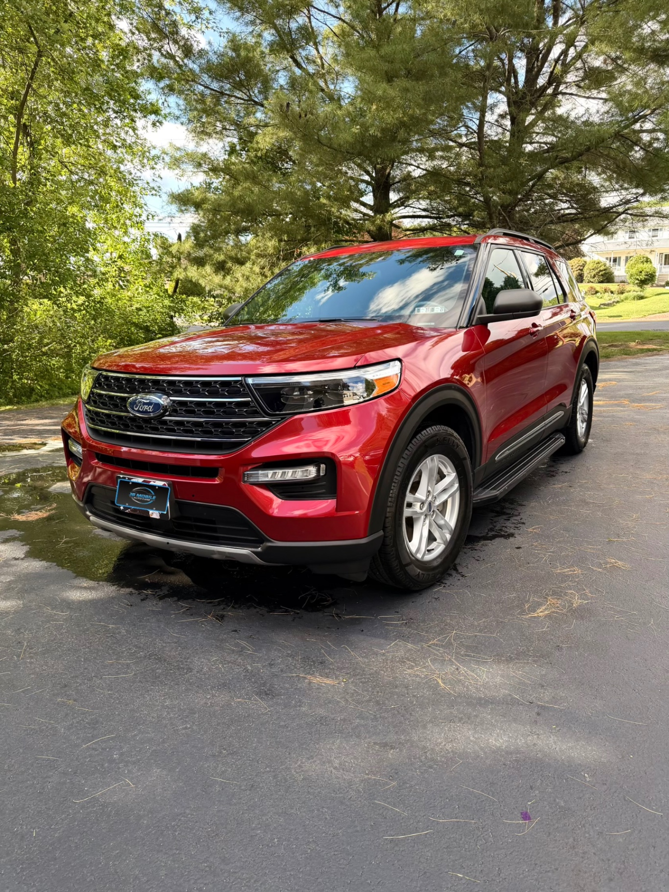 Red Ford Explorer front three-quarter after full detail