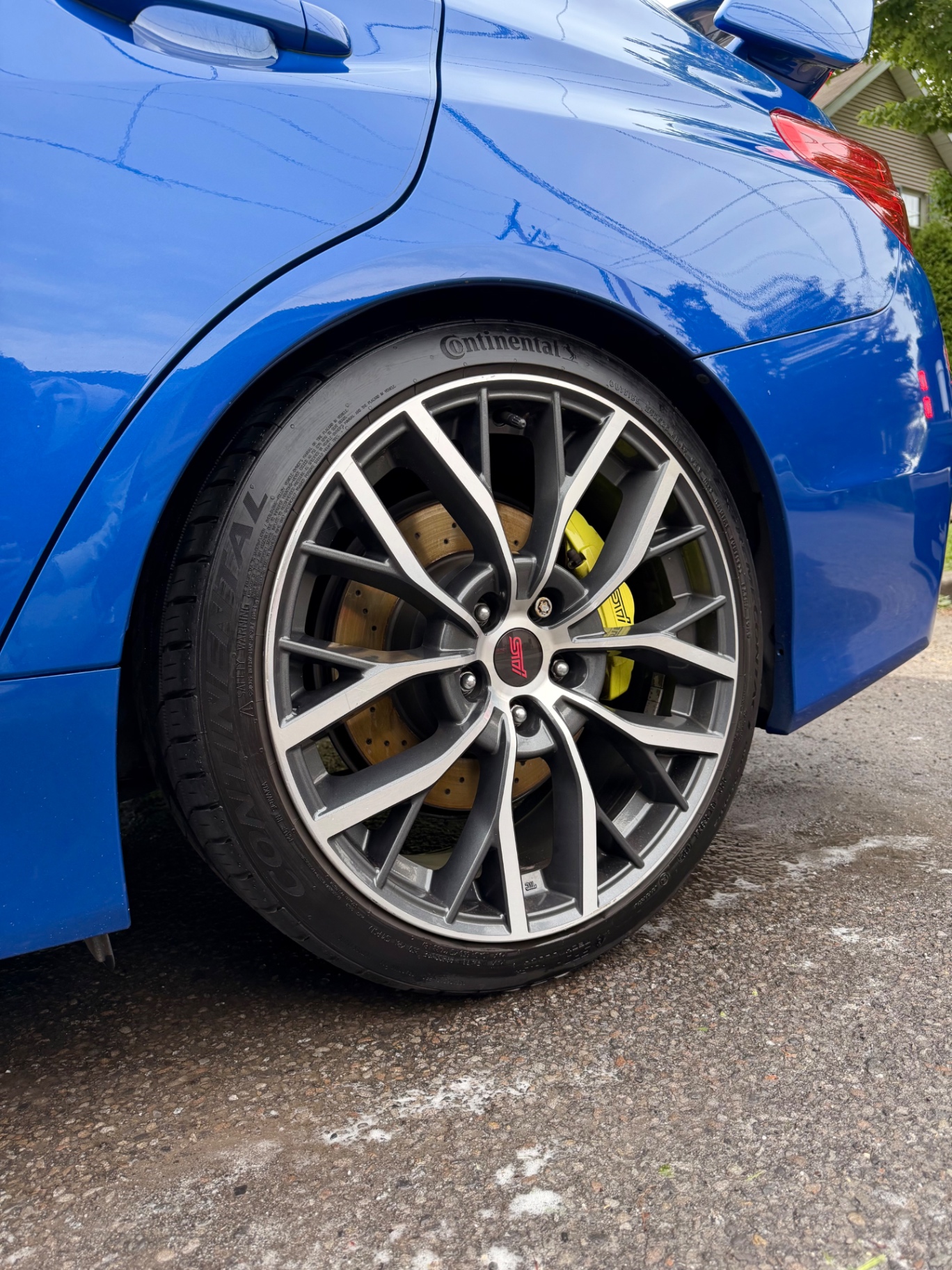 Subaru WRX STI wheel and yellow caliper close-up