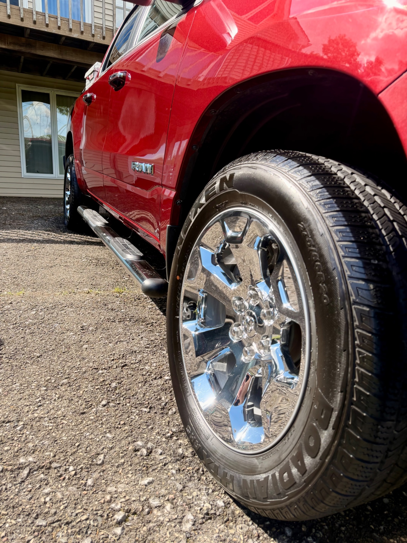 Red Ram 1500 chrome wheel and paint close-up