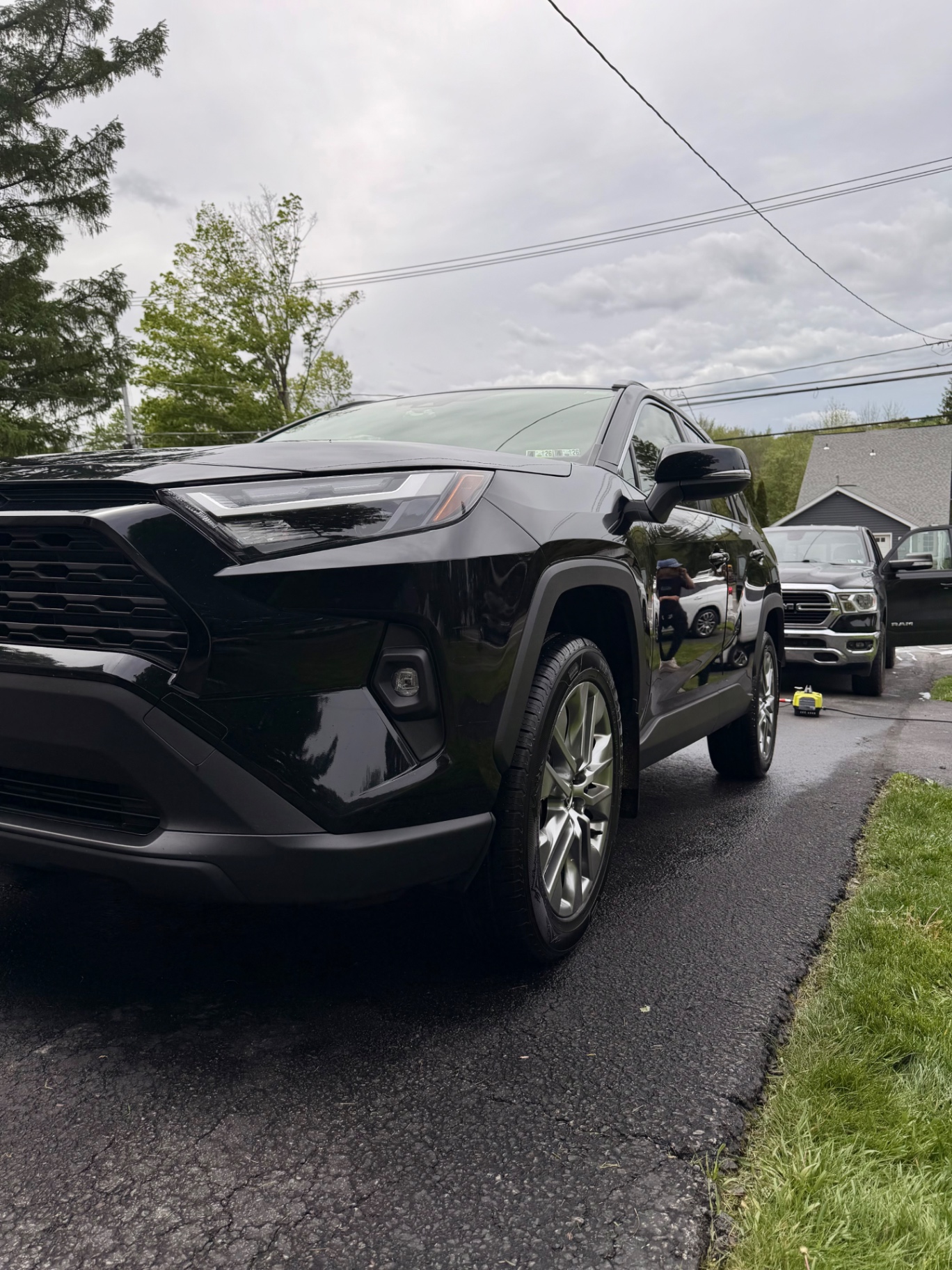 Black Toyota RAV4 front three-quarter after exterior detail