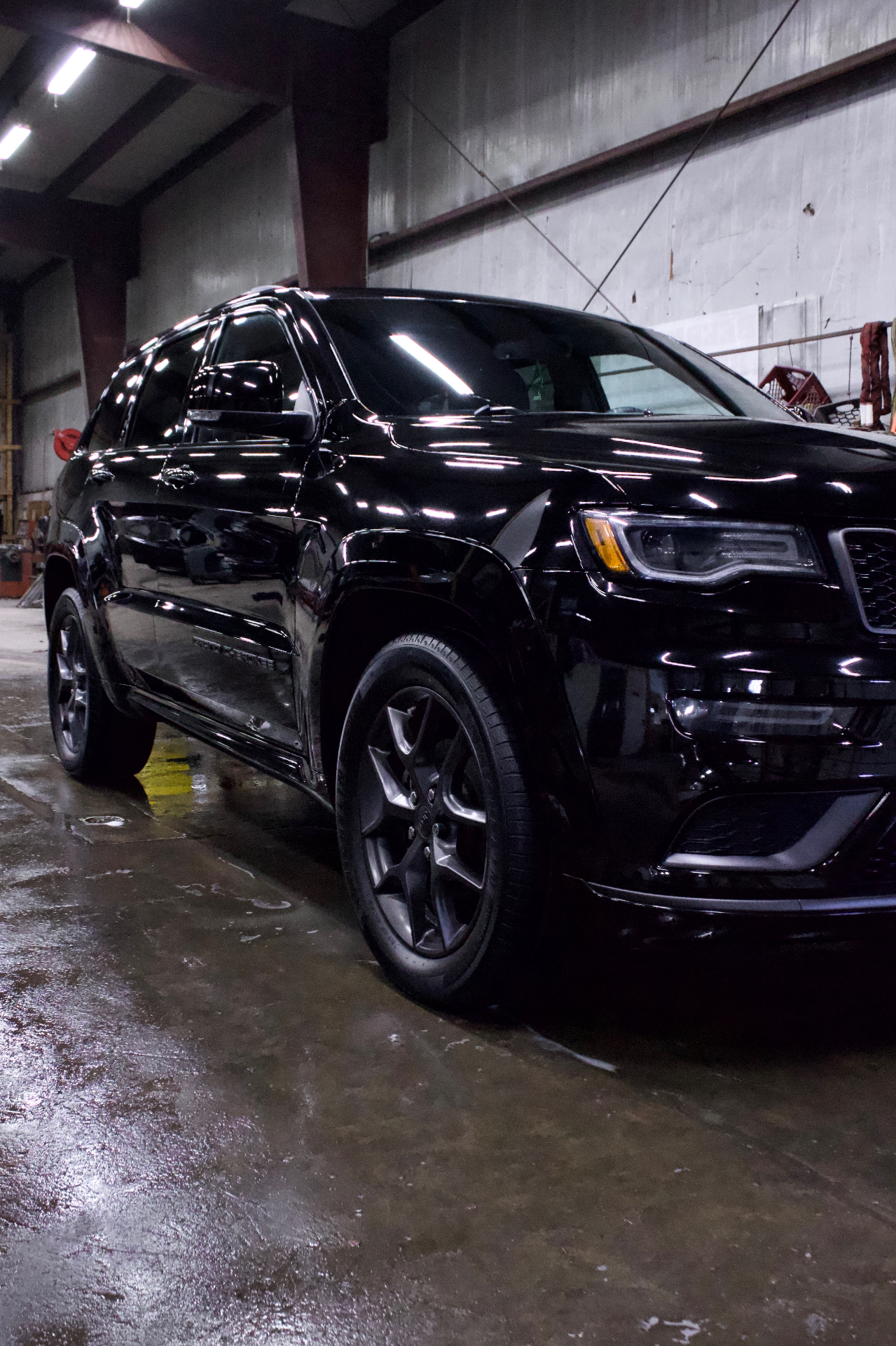 Black Jeep Grand Cherokee front three-quarter after detail